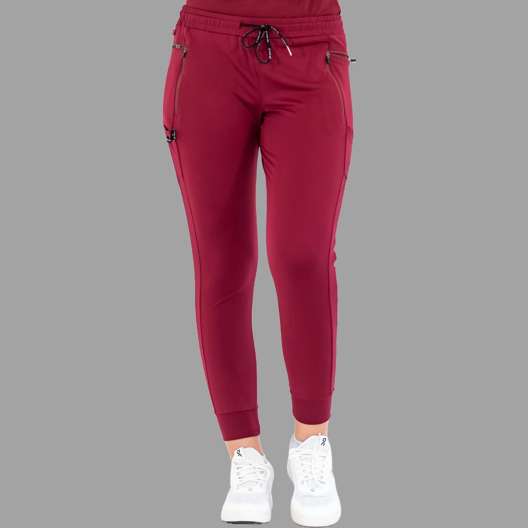 Front view of burgundy women's joggers 920, standing with feet together.